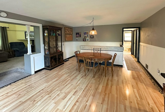 302 S Edgewood Dr, Ellettsville, IN 47429 - dining area with wood finished floors and decorative columns