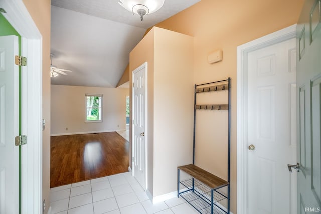 4331 Hadley Ct, West Lafayette, IN 47906 - hallway featuring lofted ceiling, baseboards, and light tile patterned floors