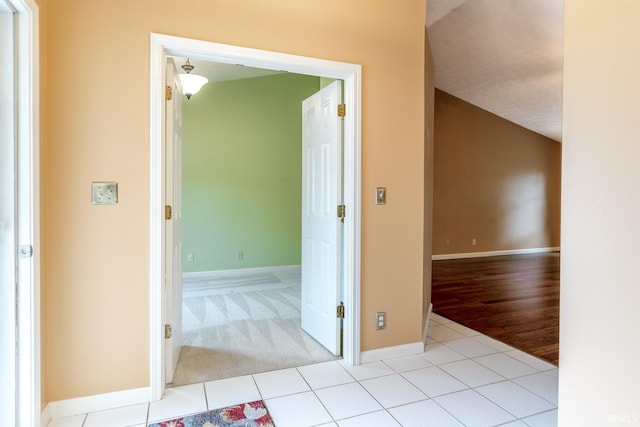 4331 Hadley Ct, West Lafayette, IN 47906 - hallway featuring baseboards, carpet, and tile patterned flooring