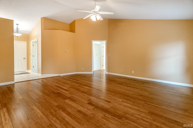 4331 Hadley Ct, West Lafayette, IN 47906 - empty room with ceiling fan, wood finished floors, high vaulted ceiling, and baseboards
