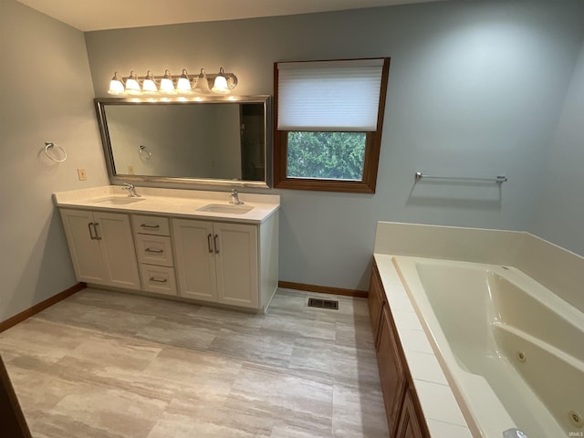 404 Ridge Ct, Ossian, IN 46777 - full bath featuring double vanity, a jetted tub, and baseboards