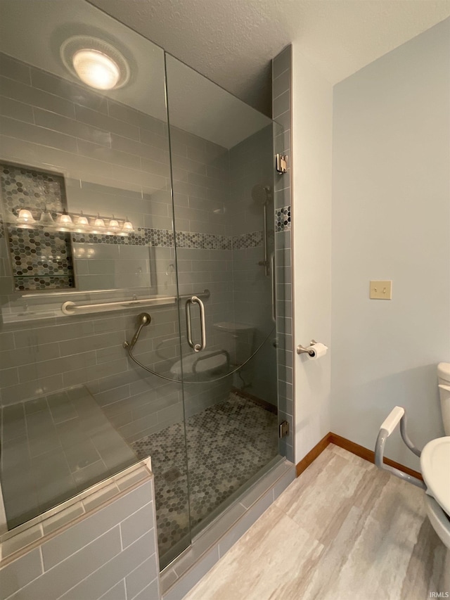 404 Ridge Ct, Ossian, IN 46777 - full bathroom with toilet, a stall shower, and baseboards