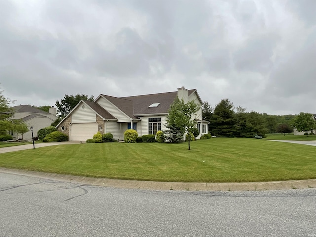 404 Ridge Ct, Ossian, IN 46777 - view of front facade with concrete driveway, an attached garage, a front yard, and a chimney