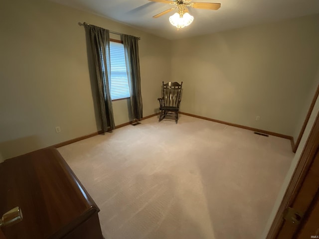 404 Ridge Ct, Ossian, IN 46777 - empty room featuring a ceiling fan, baseboards, and light colored carpet