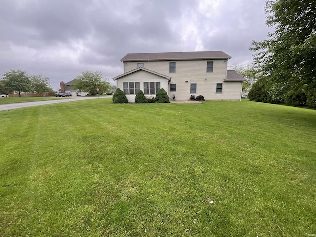 404 Ridge Ct, Ossian, IN 46777 - back of property with a yard and a patio area