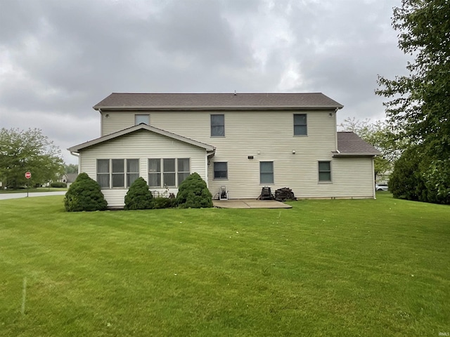404 Ridge Ct, Ossian, IN 46777 - rear view of house with a patio area and a yard