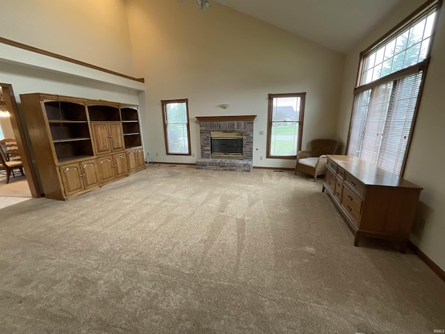 404 Ridge Ct, Ossian, IN 46777 - unfurnished living room with high vaulted ceiling, light colored carpet, a fireplace, and healthy amount of natural light