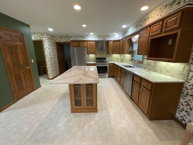 404 Ridge Ct, Ossian, IN 46777 - kitchen with stainless steel appliances, wallpapered walls, a sink, a center island, and tasteful backsplash