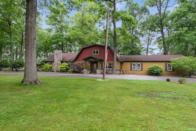 2905 E Mowrey Rd, Columbia City, IN 46725 - view of front of home with a chimney, a front yard, and driveway