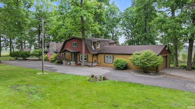 2905 E Mowrey Rd, Columbia City, IN 46725 - dutch colonial featuring driveway, a front yard, an attached garage, a gambrel roof, and roof with shingles