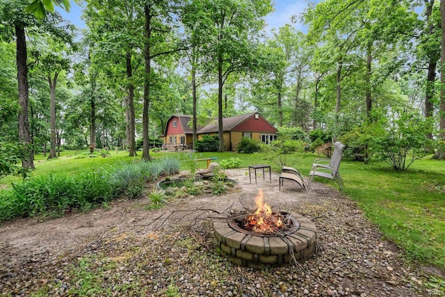 2905 E Mowrey Rd, Columbia City, IN 46725 - view of green lawn featuring an outdoor fire pit and view of scattered trees
