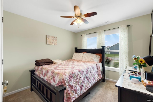 2082 Hemlock Ln, Warsaw, IN 46580 - bedroom with light carpet, baseboards, and a ceiling fan