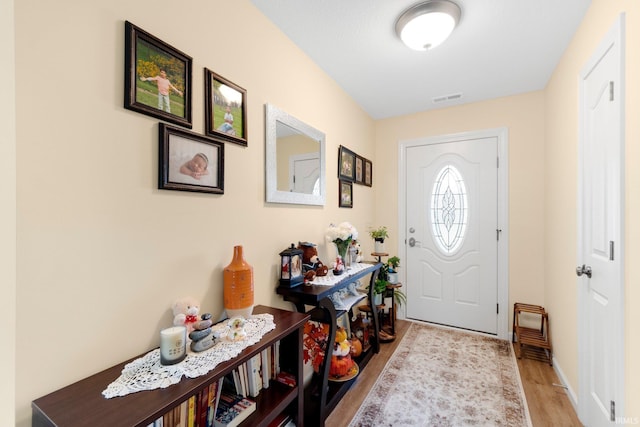 2082 Hemlock Ln, Warsaw, IN 46580 - foyer with light wood-style floors and baseboards