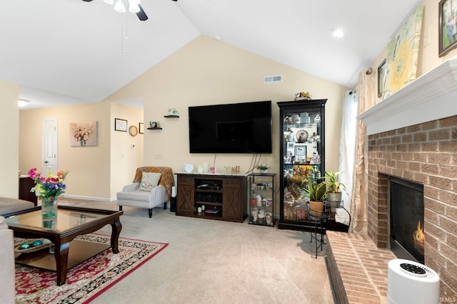 2082 Hemlock Ln, Warsaw, IN 46580 - living room with light carpet, a fireplace, a ceiling fan, and high vaulted ceiling