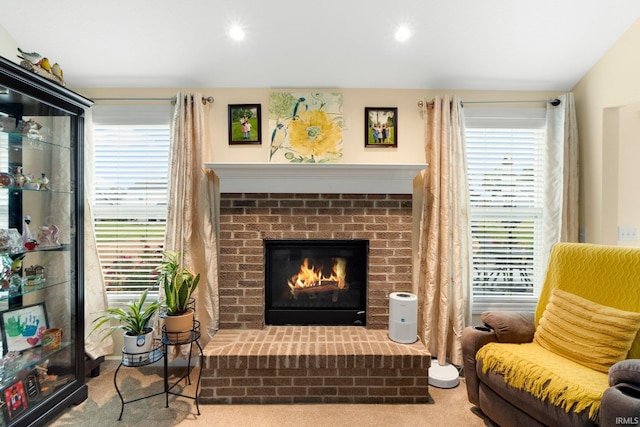 2082 Hemlock Ln, Warsaw, IN 46580 - sitting room with carpet flooring, a fireplace, and recessed lighting