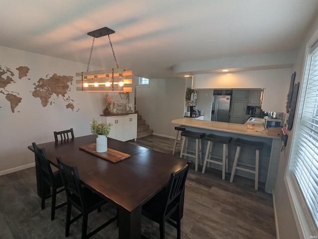 664 Columbia St, Berne, IN 46711 - dining area with stairway, dark wood finished floors, and baseboards