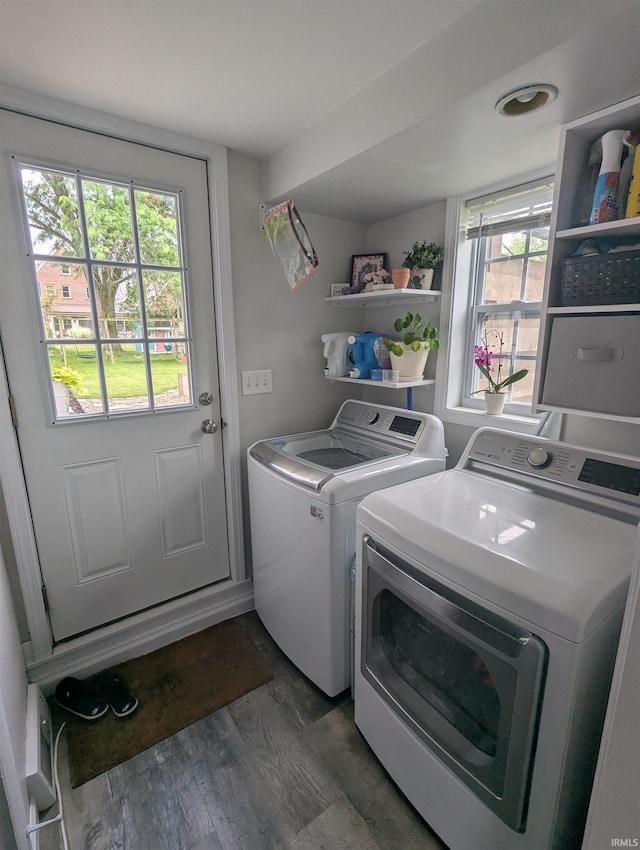 664 Columbia St, Berne, IN 46711 - washroom with independent washer and dryer, plenty of natural light, and dark wood finished floors