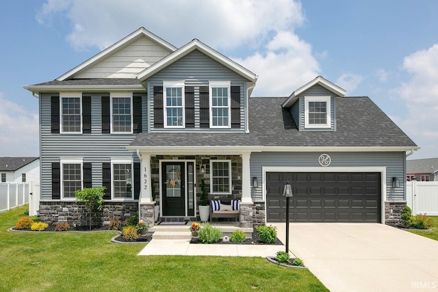1622 Cobble Hills Dr, Osceola, IN 46561 - view of front of house with stone siding, concrete driveway, an attached garage, and roof with shingles