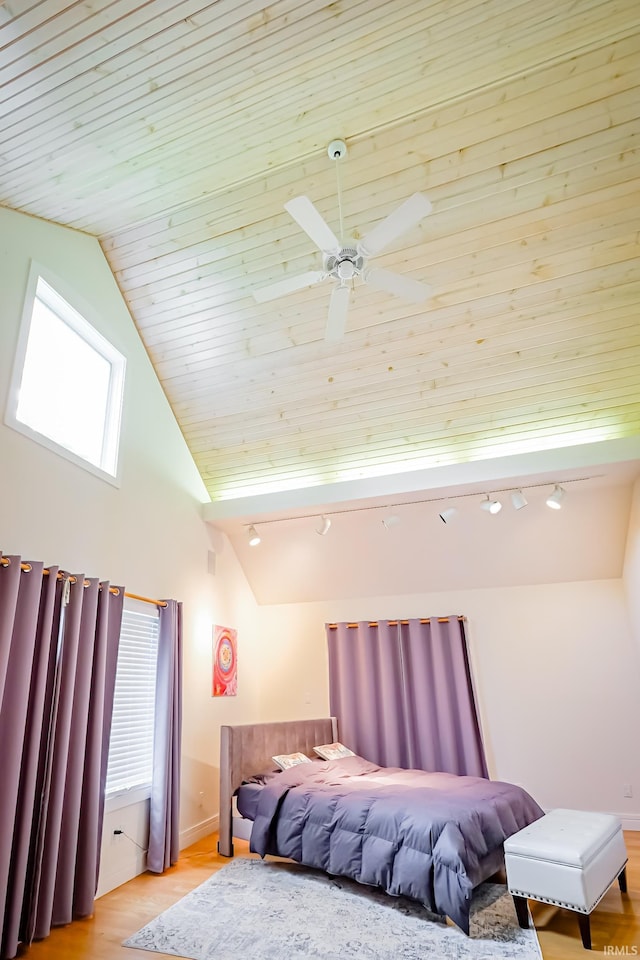 2910 W Devon Rd, Muncie, IN 47304 - bedroom with track lighting, light wood-style floors, baseboards, a ceiling fan, and high vaulted ceiling