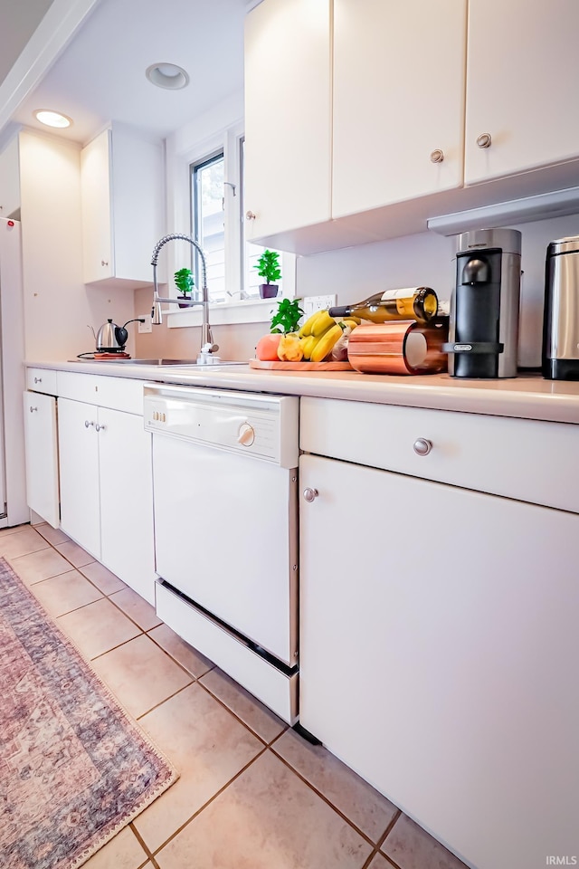2910 W Devon Rd, Muncie, IN 47304 - kitchen with white appliances, light countertops, white cabinetry, and light tile patterned flooring