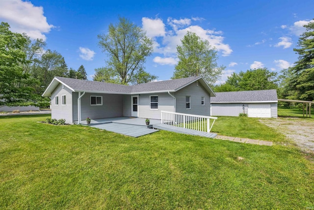 9129 Winchester Rd, Fort Wayne, IN 46819 - rear view of house featuring a yard, a garage, and roof with shingles