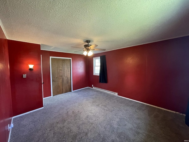 304 E 26th St, Muncie, IN 47302 - unfurnished bedroom featuring a baseboard heating unit, a textured ceiling, carpet flooring, a closet, and a ceiling fan