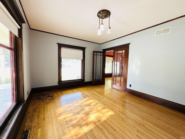 201 N Lafayette St, North Liberty, IN 46554 - empty room with crown molding, baseboards, and wood finished floors