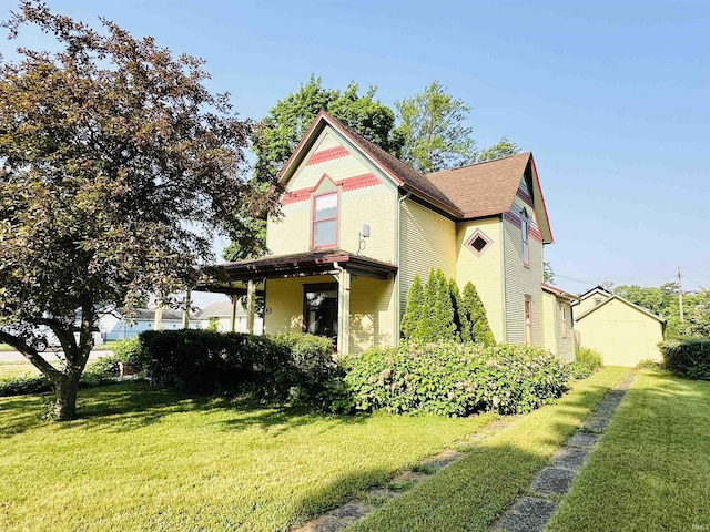201 N Lafayette St, North Liberty, IN 46554 - view of side of property featuring a lawn and roof with shingles