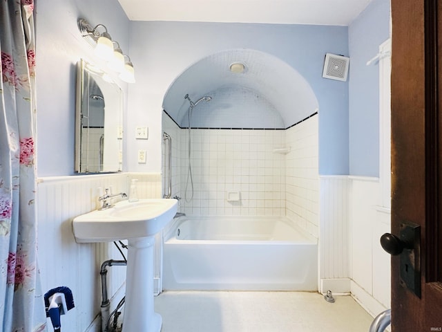201 N Lafayette St, North Liberty, IN 46554 - bathroom with wainscoting and shower / tub combo