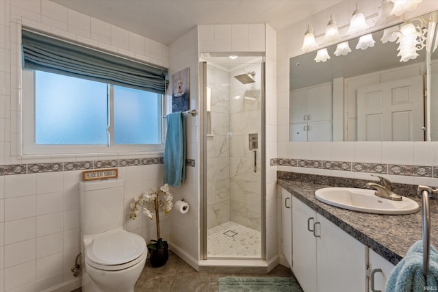 61560 Druid Ln, South Bend, IN 46614 - bathroom with vanity, a stall shower, toilet, tile walls, and tile patterned flooring