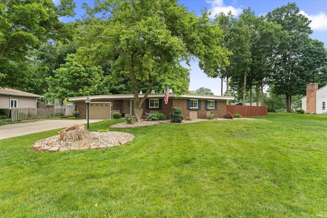 61560 Druid Ln, South Bend, IN 46614 - ranch-style home with concrete driveway, an attached garage, and brick siding