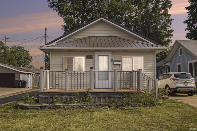 3311 Ardmore Trl, South Bend, IN 46628 - view of front facade featuring metal roof, a front lawn, and a porch
