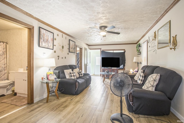 3311 Ardmore Trl, South Bend, IN 46628 - living area featuring light wood-type flooring, ceiling fan, a textured ceiling, baseboards, and ornamental molding
