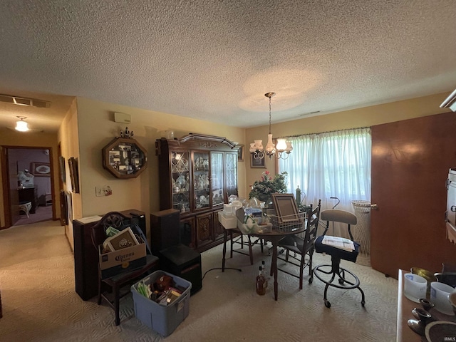 520 S Butterfield Rd, Muncie, IN 47302 - dining room with light colored carpet, a textured ceiling, and a chandelier