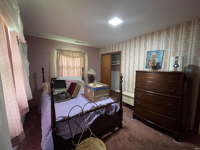 520 S Butterfield Rd, Muncie, IN 47302 - carpeted bedroom with wallpapered walls, a closet, and baseboards