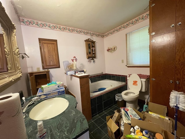 520 S Butterfield Rd, Muncie, IN 47302 - bathroom featuring a sink, a garden tub, toilet, and tile patterned flooring