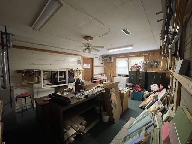 520 S Butterfield Rd, Muncie, IN 47302 - miscellaneous room featuring wood walls, ceiling fan, and a workshop area
