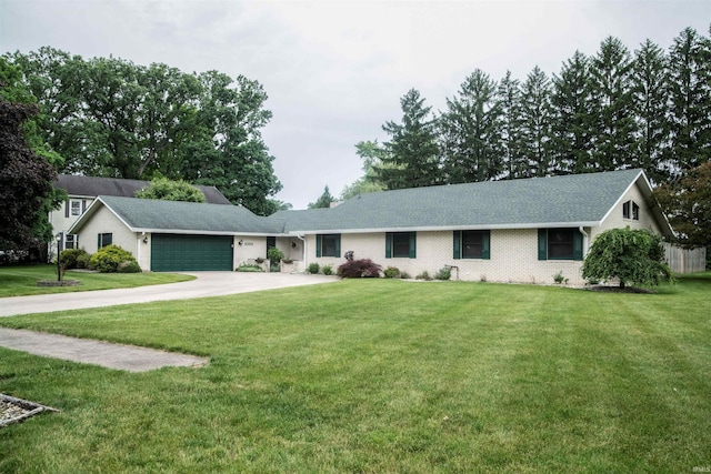 5101 Weir Dr, Muncie, IN 47304 - ranch-style house with an attached garage, concrete driveway, a front yard, and brick siding