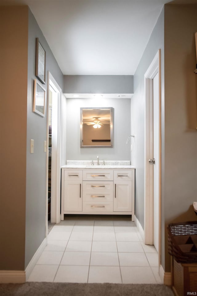 5101 Weir Dr, Muncie, IN 47304 - bathroom with vanity, tile patterned floors, and baseboards