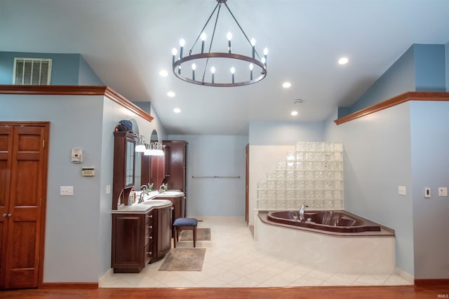 5101 Weir Dr, Muncie, IN 47304 - full bathroom with vaulted ceiling, vanity, a garden tub, a chandelier, and recessed lighting