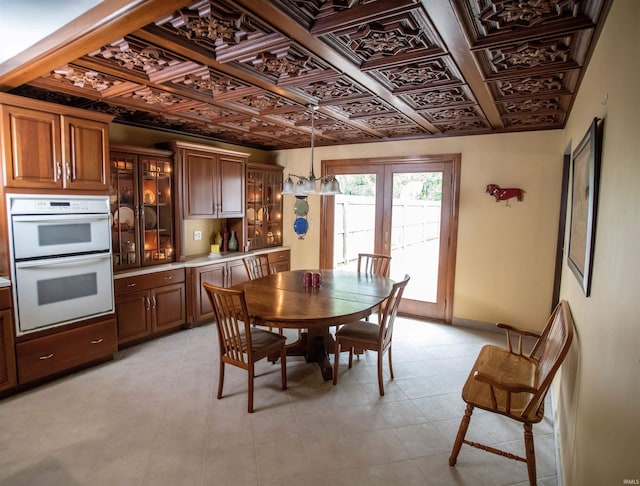 5101 Weir Dr, Muncie, IN 47304 - dining area with baseboards, light tile patterned floors, and an ornate ceiling