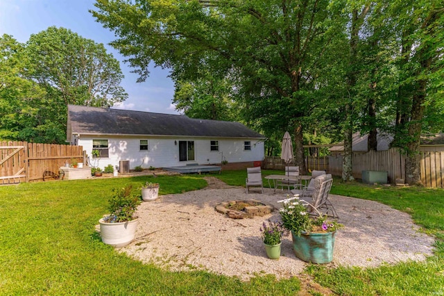 863 S Melchior Dr, Santa Claus, IN 47579 - back of property featuring a patio area and a fire pit