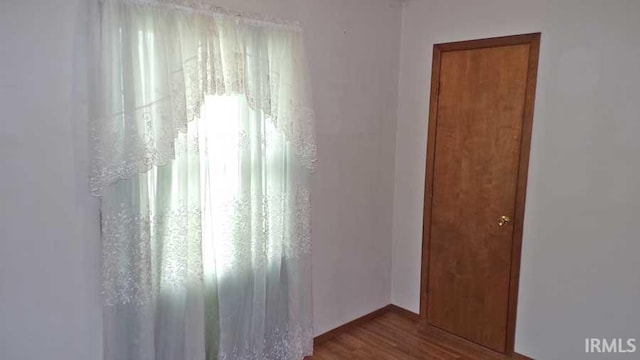 1001 Barnett St, Vincennes, IN 47591 - spare room featuring dark wood finished floors