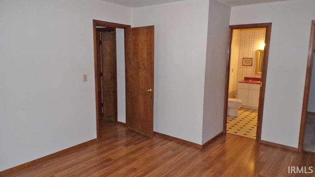 1001 Barnett St, Vincennes, IN 47591 - unfurnished room featuring wood finished floors and baseboards