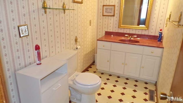 1001 Barnett St, Vincennes, IN 47591 - bathroom featuring toilet, vanity, and tile patterned floors