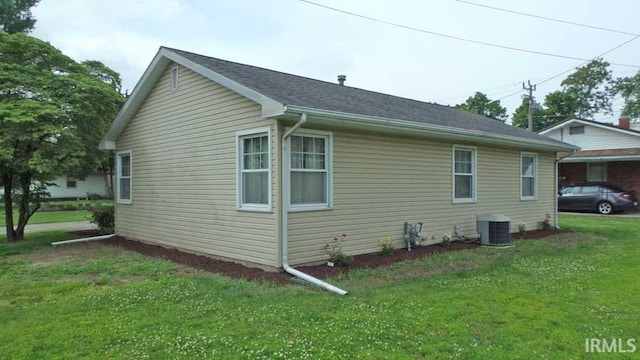 1001 Barnett St, Vincennes, IN 47591 - view of home's exterior featuring cooling unit and a lawn