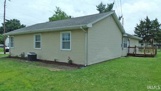 1001 Barnett St, Vincennes, IN 47591 - view of home's exterior with central AC unit, a deck, and a yard