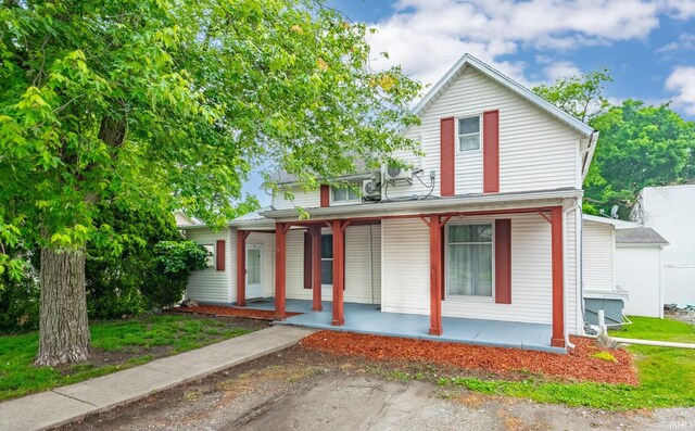 415 N Washington St, Warsaw, IN 46580 - view of front facade with a porch