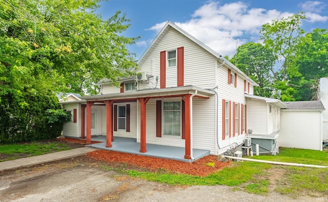 415 N Washington St, Warsaw, IN 46580 - farmhouse inspired home with a porch and a cooling unit