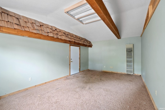415 N Washington St, Warsaw, IN 46580 - carpeted empty room with vaulted ceiling, a heating unit, and baseboards